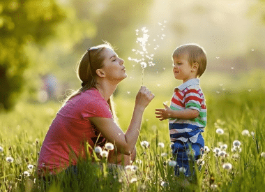 Mother & son blowing on a dandelion