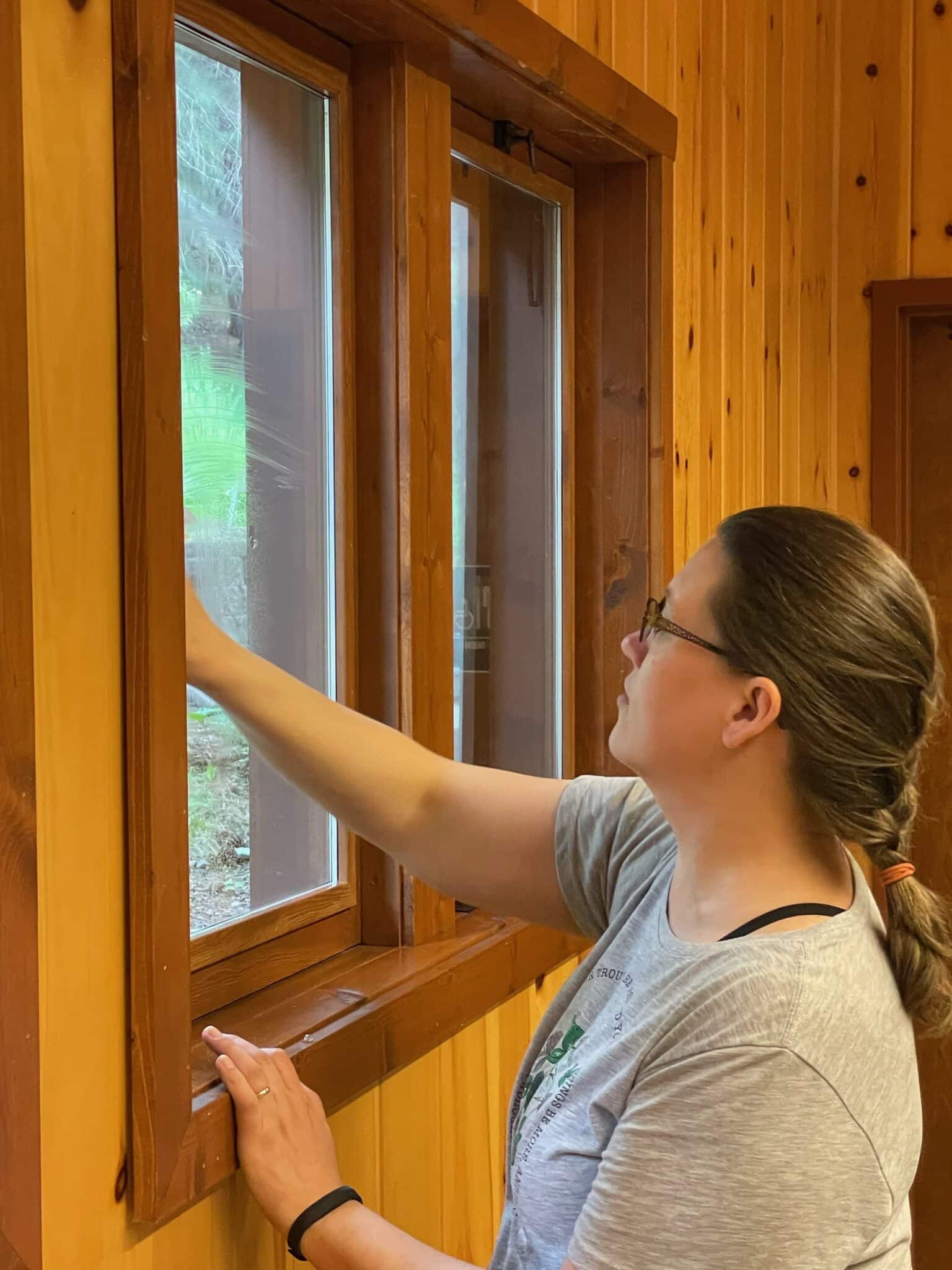 Wilkinson employee cleaning windows at Camp Prime Time