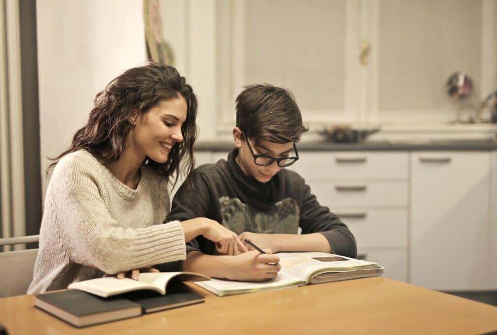 Mom helping child with homework